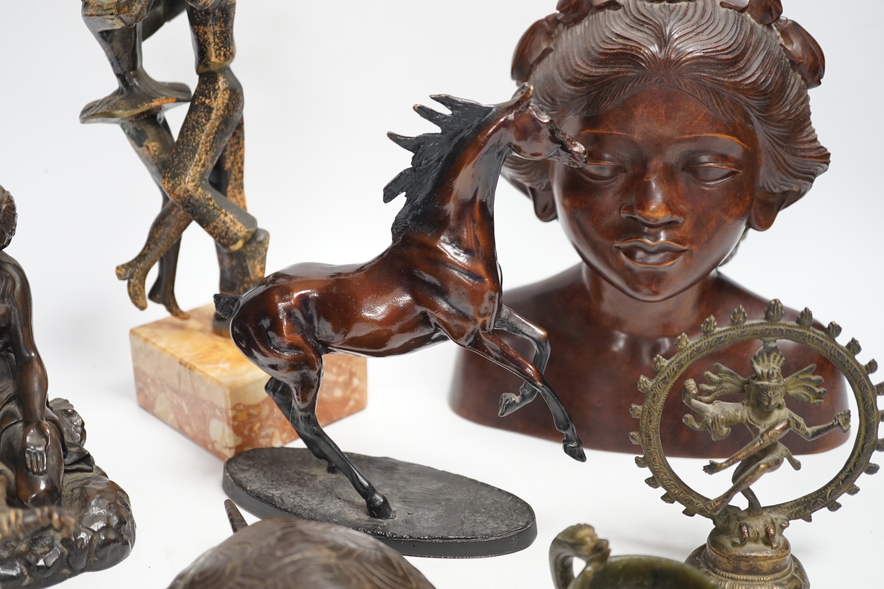 Mixed metal and carved ornaments, including a tortoise table bell, a statue of two dancers and a Balanese head, etc, 22cm
